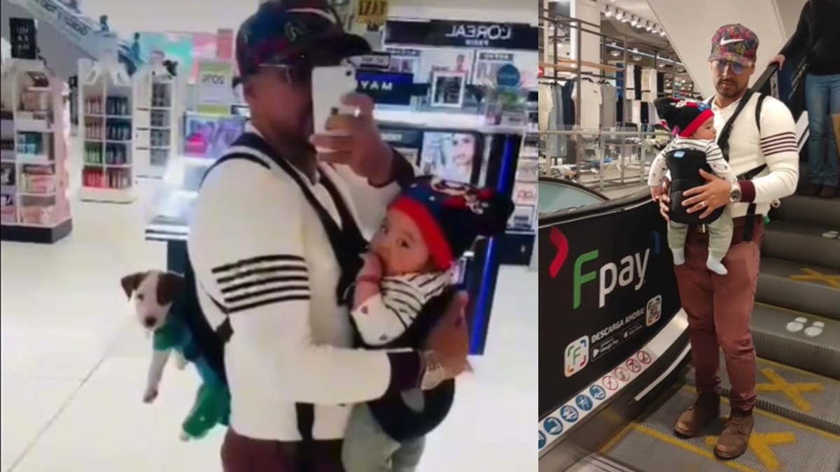 Se hace viral video de padre cargando a su hijo y cachorro